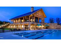 Stunning community clubhouse with an outdoor pool with lap lanes, perfect for relaxation and recreation at 1524 Level Stream Rd, Wendell, NC 27591