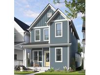 Charming two-story home with blue siding, white trim, covered porch, and well-manicured lawn at 1573 Piney Falls Dr, Wendell, NC 27591