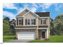 Charming two-story home featuring a two-car garage and neutral color palette at 209 E American Marigold Dr # 44, Benson, NC 27504