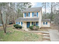 Charming two-story home with blue shutters and well-maintained front yard and walkway at 3323 Nantuckett Ave, Durham, NC 27703
