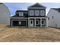 Charming two-story home with white trim and an attached two-car garage at 704 Compeer Way # 28, Rolesville, NC 27571