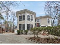 Charming home with a two-story entry and detailed trim, set in a landscaped yard, perfect for families at 104 Sierra Dr, Chapel Hill, NC 27514