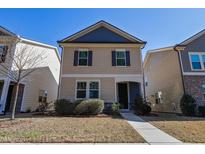 Charming two-story home with manicured lawn, blue trim, and welcoming entrance at 109 Belle Plain Dr, Morrisville, NC 27560