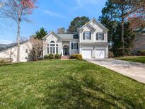 Charming two-story home with a well-manicured lawn and a two car garage at 109 Wentbridge Rd, Cary, NC 27519