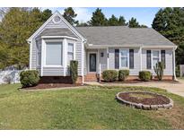 Charming single-story home featuring a well-maintained yard and classic curb appeal at 1101 Oakside Ct, Raleigh, NC 27615