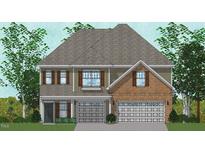 Charming two-story home with a brick and siding exterior, shutters, and a two-car garage at 3015 Dog Rose Drive Lot 170 Dr, Durham, NC 27703