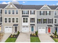 Townhomes with garages and landscaped front yards offer curb appeal at 607 Silverado Sunset Loop, Wendell, NC 27591