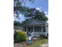 Charming single-story home featuring a well-manicured front yard and inviting entryway at 1111 Lancaster St, Durham, NC 27701