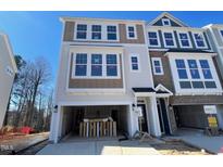 Two-story new construction home with a spacious two-car garage and modern color palette at 1206 Alston Landing Way # 08, Cary, NC 27519