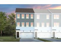 Stylish townhome featuring a gray and white facade, attached garage, and well-manicured lawn at 1413 Chrysalis Pl, Apex, NC 27502