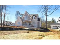 Stunning new construction featuring charming architectural details and a manicured landscape at 2829 Theresa Eileen Way, Raleigh, NC 27603