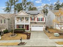 Charming two-story home with a inviting front porch and well-manicured landscaping at 2310 Gilman St, Durham, NC 27703