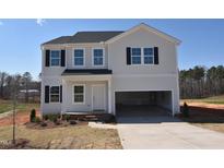 Charming two-story home with light siding, black shutters, and an attached two-car garage, perfect for modern living at 35 Calabria Ct, Franklinton, NC 27525