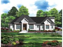 Charming brick home featuring a dark roof, a well-manicured lawn, and professional landscaping at 63 Pennington Cir, Chapel Hill, NC 27517
