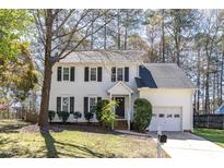 Charming two-story home featuring a well-manicured lawn and attached garage at 101 Gorecki Pl, Cary, NC 27513