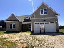 Charming new construction home boasts modern design and a two-car garage at 141 Noramac Ct, Selma, NC 27576
