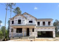 New construction home featuring a covered porch and an attached two-car garage ready to be customized at 266 Golfview Ave, Benson, NC 27504