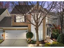 Inviting two-story brick home with a well-manicured lawn and attached two-car garage at 3509 Archdale Dr, Raleigh, NC 27614