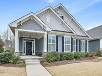 Charming single Gathering home with inviting front yard at 2013 Big Falls Dr, Wendell, NC 27591