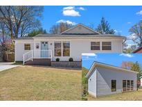 Charming home with landscaped yard, updated exterior, and stylish blue front door and a bonus building at 2330 Glascock St, Raleigh, NC 27610