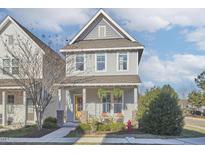 Charming two-story home with a welcoming front porch and well-maintained landscaping at 75 Mallard Landing Dr, Chapel Hill, NC 27516