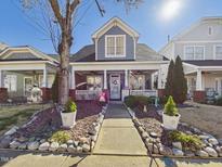 Charming home with a welcoming front porch and professionally landscaped front yard at 10836 Connally Ln, Raleigh, NC 27614
