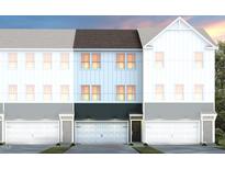 Charming townhome exterior with multiple garages, white siding, and a modern design at 1518 Tamarisk Ln, Durham, NC 27703