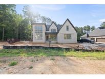 Striking two-story new construction home with brick and siding and an attached garage at 2957 Wexford Pond Way, Wake Forest, NC 27587