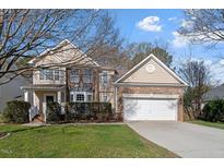 Traditional two-story home with brick and siding exterior and an attached two-car garage at 4619 Paces Ferry Dr, Durham, NC 27712