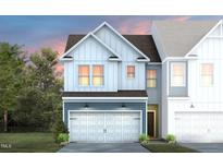 Charming two-story home featuring a white garage door and blue accents at 6000 Enclosure Way, Durham, NC 27703