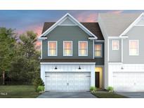Two-story home featuring a two-car garage, hardiplank siding and a covered front porch at 6001 Enclosure Way, Durham, NC 27703