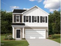 Charming two-story home featuring black shutters, white siding, and an attached two-car garage at 837 Kenyon Spring Dr, Zebulon, NC 27597