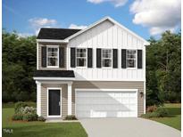 Charming two-story home featuring black shutters, white siding, and a two-car garage at 1140 Centerview Drive, Nashville, NC 27856