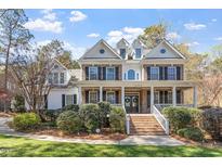 Beautiful two-story brick home with a large front porch and well-manicured landscaping at 3504 Griffice Mill Rd, Raleigh, NC 27610