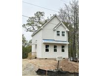 Charming new construction with white siding and a classic gable roof design at 908 Colfax St, Durham, NC 27701