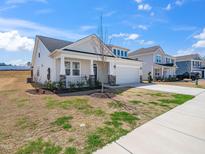 Charming single-Gathering home with a well-manicured lawn and a two-car garage at 217 Mallard Loop Dr, Clayton, NC 27527