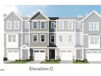 Charming townhome with attractive gray siding, black shutters, and a well-maintained front lawn at 404 Deercroft Dr, Apex, NC 27539