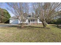 Charming single-Gathering home with a well-maintained lawn and attached garage at 63 Halter Ct, Angier, NC 27501