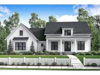 Charming two-story home with black window frames, white siding and picket fence at Lot 10H Good Shepherd Trl, Spring Hope, NC 27882