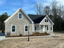 Charming new construction home with stone accents and a covered front porch at Lot 14H Good Shepherd Trl, Spring Hope, NC 27882