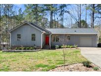 Charming single story home with a neutral paint and mature trees at 2 Edgestone Pl, Chapel Hill, NC 27517