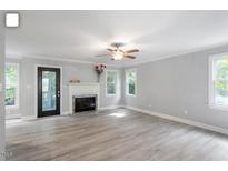 Spacious living room features hardwood floors, fireplace and natural light at 2812 Dahlgreen Rd, Raleigh, NC 27615