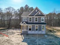 New two-story home with gray siding, white trim, and traditional architectural details at 452 Duncan Creek Rd # 156, Lillington, NC 27546