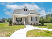 Charming brick home with a welcoming front porch and manicured lawn at 55 Glasgow, Rocky Mount, NC 27804