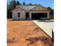 New construction home featuring a two-car garage and concrete driveway at 65 Crow Field St, Roxboro, NC 27574