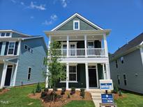 Two-story home with a charming front porch and manicured landscaping for curb appeal at 732 Georgia'S Landing Pkwy # 8, Raleigh, NC 27603