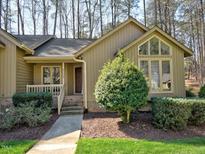 Charming single-story home featuring a well-manicured lawn and inviting front entrance at 8008 Grey Oak Dr, Raleigh, NC 27615