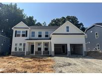 New two-story home featuring a two car garage, covered porch, and craftsman style architectural details at 740 Portland Rose Dr, Knightdale, NC 27545