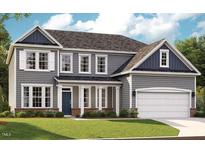 Charming two-story home with gray siding, white trim, and a well-manicured lawn at 740 Portland Rose Dr, Knightdale, NC 27545