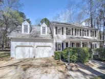 Charming two-story traditional home featuring a two-car garage, dormers, and well-manicured landscaping at 4216 High Mountain Dr, Raleigh, NC 27603